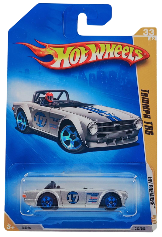 Hot Wheels 2009 - Collector # 033/166 - HW Premiere 33/42 - Triumph TR6 - Metalflake Silver / Blue Stripes / #17 - International Card