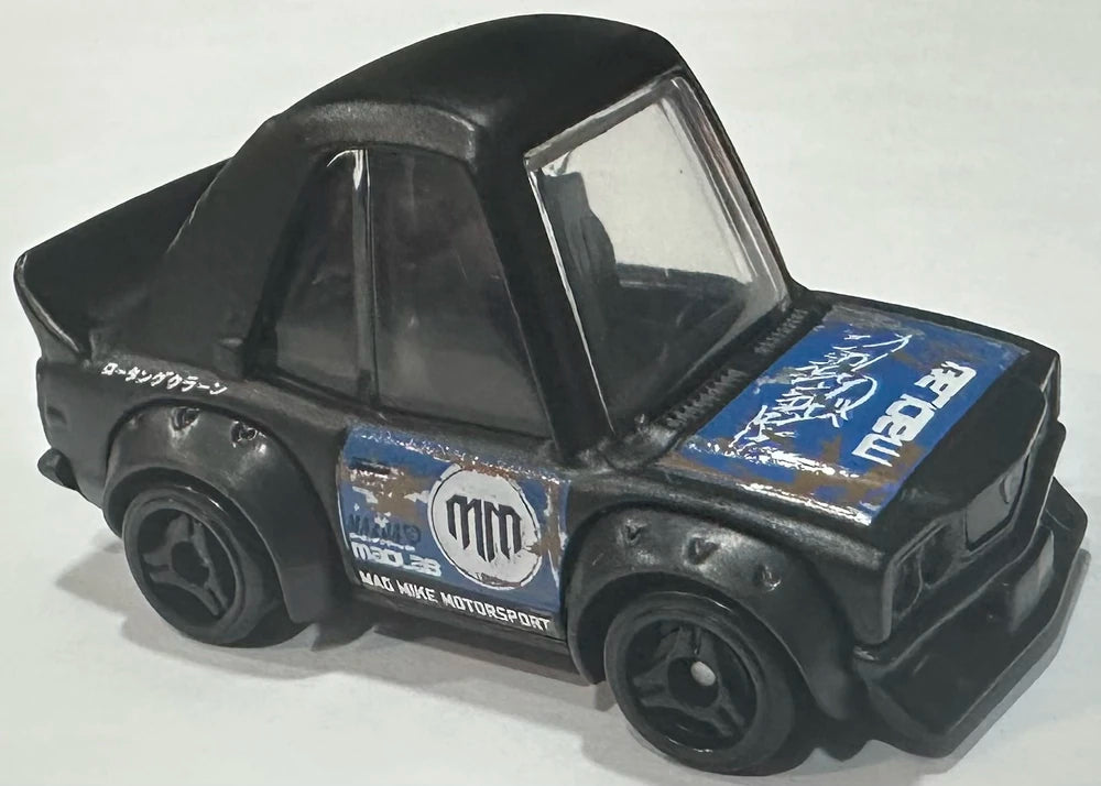 Hot Wheels 2025 - Collector # 196/250 - Compact Kings 8/10 - Mazda RX-3 (Tooned) - Black / Mad Mike Graphics - USA 'MM' Card
