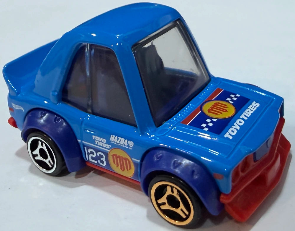 Hot Wheels 2026 - Collector # 142/250 - Tooned 1/5 - Mazda RX-3 - Blue / #123 - USA '2026 Mad Mike' Card