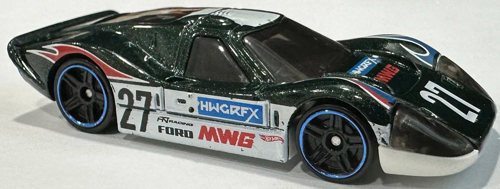 Hot Wheels 2024 - Collector # 220/250 - Then and Now 5/10 - '67 Ford GT40 Mk.IV - Metalflake Dark Green / #27 / Various Racing Decals - IC