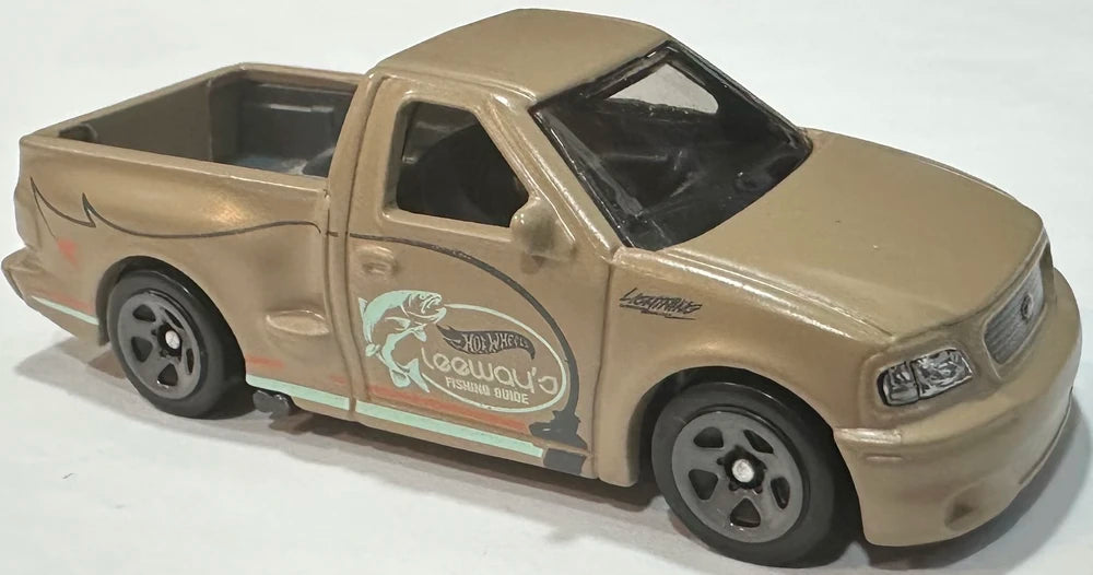 Hot Wheels 2025 - Collector # 094/250 - HW Hot Trucks 7/10 - '99 Ford F-150 SVT Lightning - Matte Beige / "Leeway's FISHING GUIDE" - USA Card