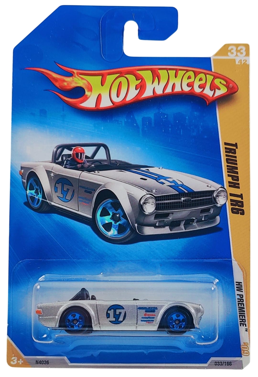 Hot Wheels 2009 - Collector # 033/166 - HW Premiere 33/42 - Triumph TR6 - Metalflake Silver / Blue Stripes / #17 - International Card