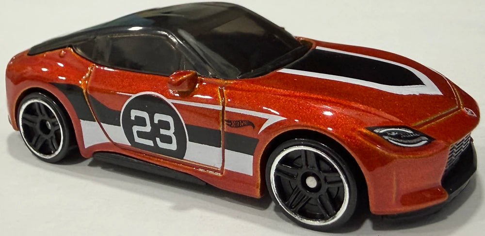 Hot Wheels 2026 - Collector # 121/250 - Then and Now 5/10 - 2023 Nissan Z - Dark Orange Metallic/ #23 - PR5 Wheels - USA '2026' Card