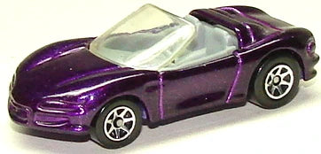 Hot Wheels 1997 - Collector # 595 - Corvette Sting Ray III - Metallic Purple - 7 Spokes - USA Blue & White Card