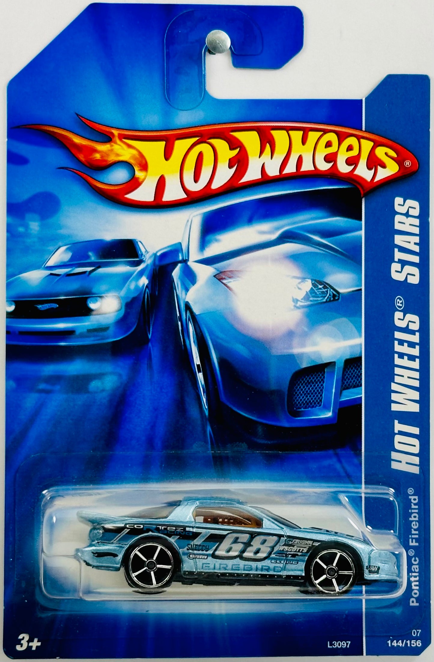 Hot Wheels 2007 - Collector # 144/156 - Hot Wheels Stars 12/24 - Pontiac Firebird - Metallic Light Blue - '68' / 'Corttez Racing' - OH5SP Wheels - Internatioanl Long Card